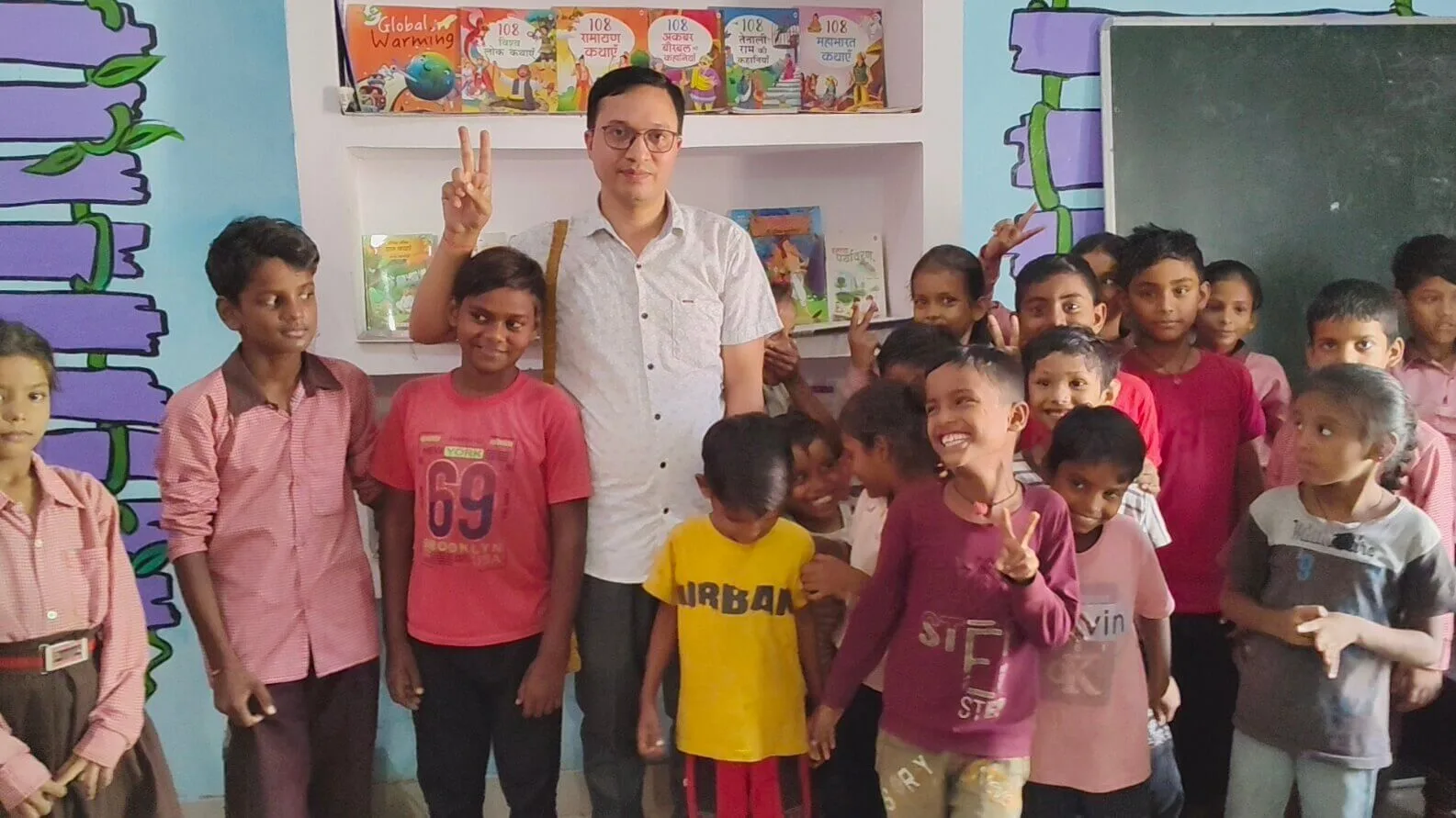Founder with students celebrating library launch