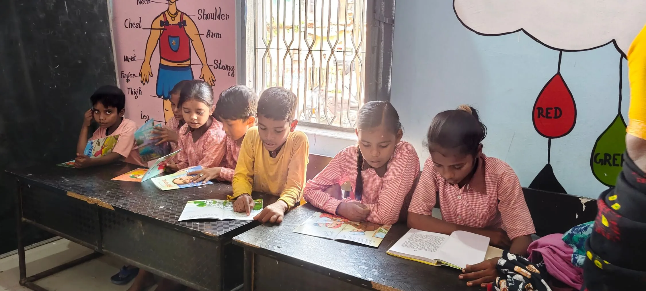 Happy children holding their chosen books