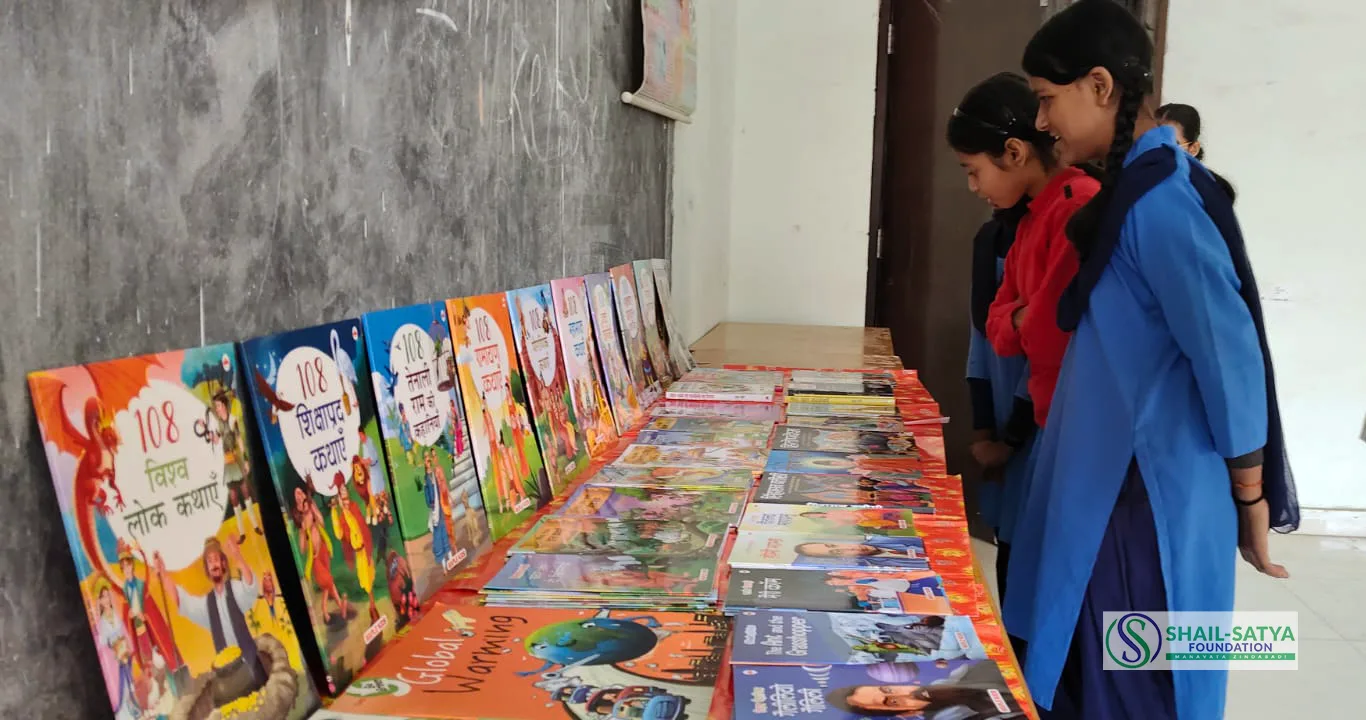 SSF team members at a school library with memento